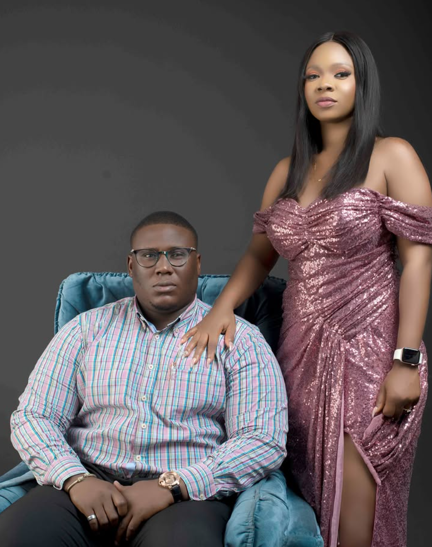 Seated formal portrait of a couple in evening wear