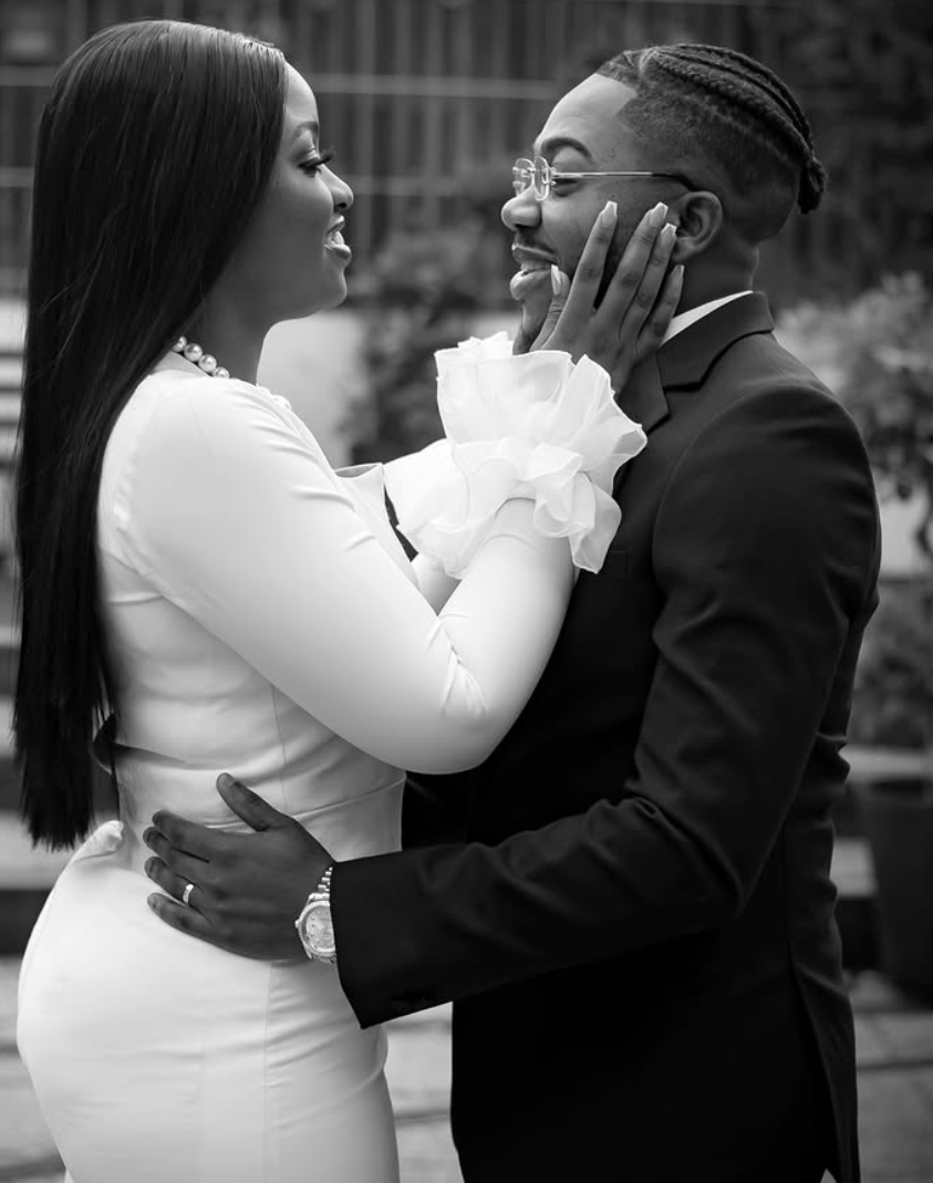 Black and white portrait of a couple laughing together